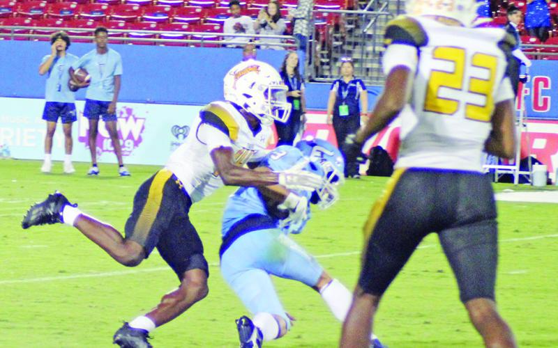 Xavier Hills brings down a ball carrier while teammate Antez Jeffrey backs up the play during a recent game. Mount Pleasant will return to Sam Parker Field for Homecoming Friday against Nacogdoches. TRIBUNE PHOTO / QUINTEN BOYD