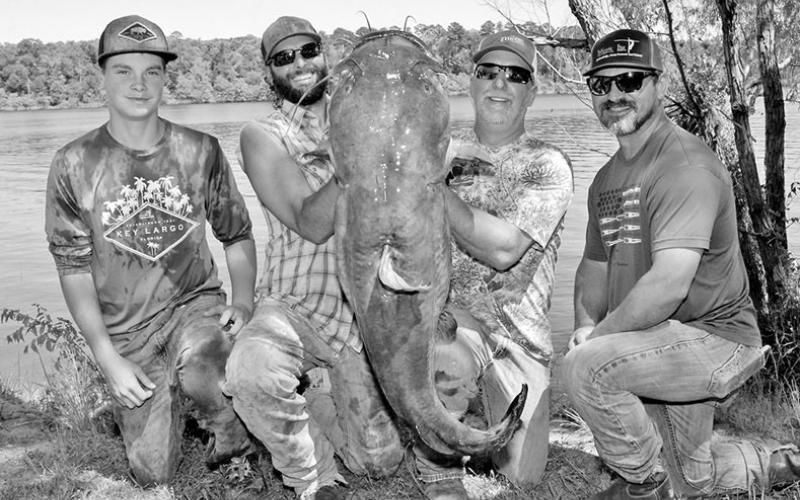 Team Hook, Line and Drinkers inlcluding Drew Higginbotham, Jason Yeley, Nick Copeland and Caden Higginbotham split $3,700 for catching event’s overall big flathead, a 54.4 pounder. COURTESY PHOTOS / MATT WILLIAMS