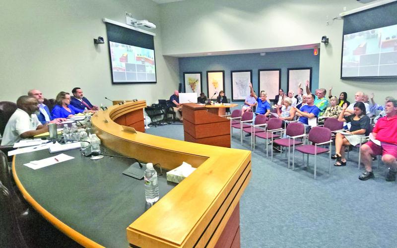 The council takes a show of hands to better understand what the people want for the upcoming election