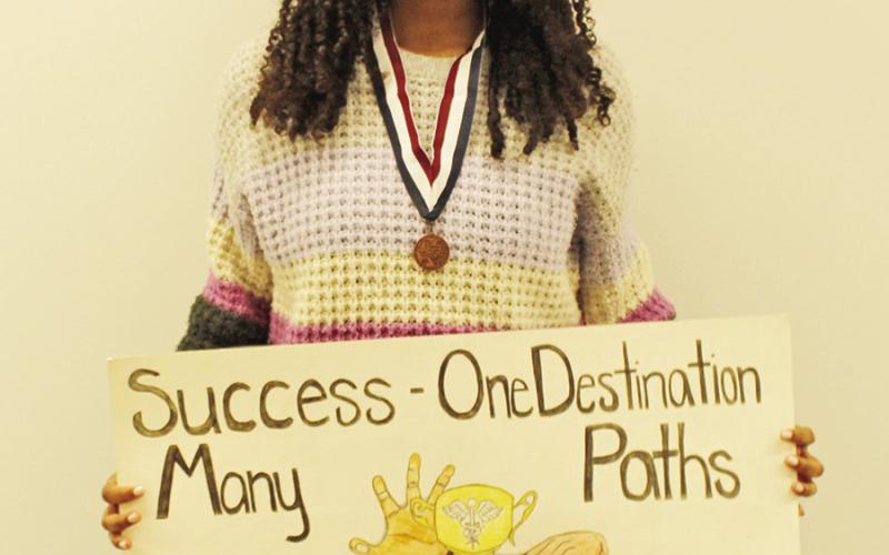 Erika Mickens with her state advancing Medical Art Poster.