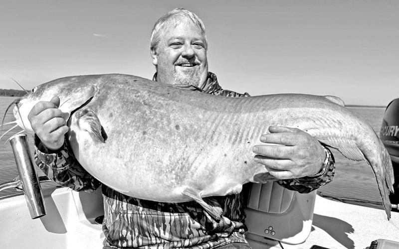 Kevin Williford of Woodville made a trip to Lake Tawakoni in mid-March with high hopes of reeling in a blue catfish heavier than the 72 pounder he caught there seven years ago. Fishing guide Michael Littlejohn delivered the goods by putting the angler on this 74.5 pounder. The fat cat ate a big slab of fresh carp Williford was drifting over an underwater point in about 18 feet of water. (Courtesy Photo)