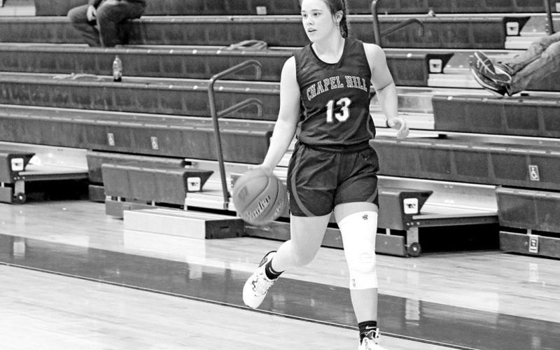 Katie Hart brings the ball upcourt during a recent game. Hart was named MVP at the Central Heights Holiday Hoopfest as Chapel Hill claimed the title. The Lady Devils are ranked ninth by tabchoops.org, 25th by txhsgbb.com and have won their last six games.