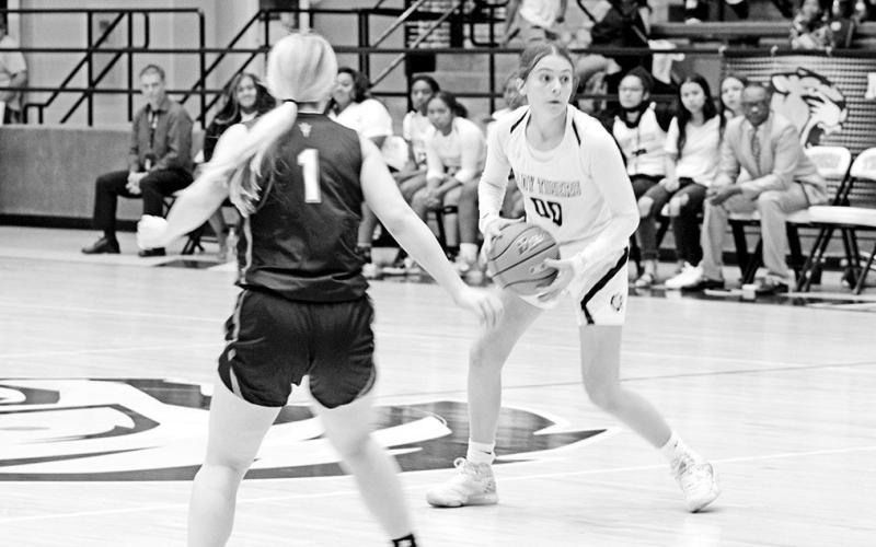Mount Pleasant’s Ella Cross scans the court during a recent game. The Lady Tigers are 2-0 on the season and traveled to New Boston Tuesday. Mount Pleasant will play in the Crandall Tournament this weekend. TRIBUNE PHOTO / QUINTEN BOYD