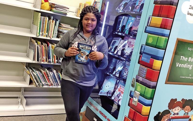 Fourth-grader Jordyn Bryant with her new book