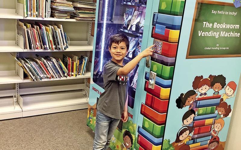 Kindergartener Carlos Campos makes his selection