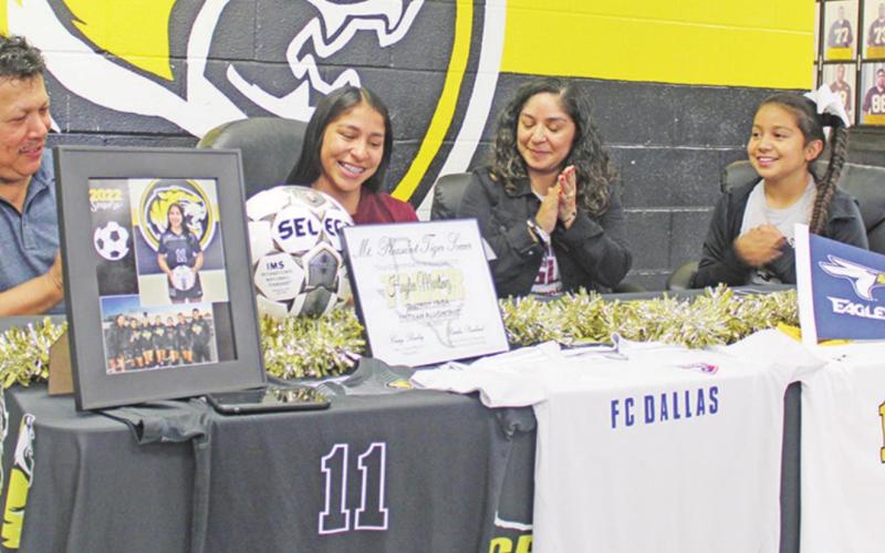 Mount Pleasant soccer player Haylee Martinez signed her letter of intent to play soccer at Texas A&amp;amp;M-Texarkana, last week on her 18th birthday. TRIBUNE PHOTO / QUINTEN BOYD