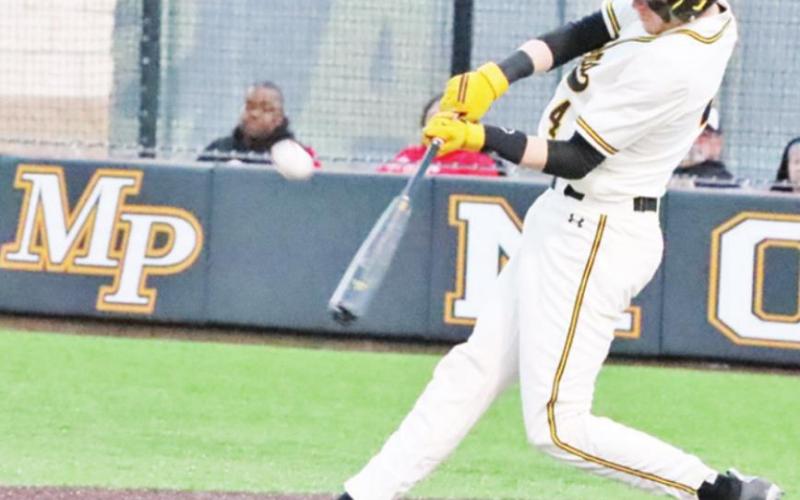 Layne Pinckard drives the ball. PHOTO BY JOHN WHITTEN