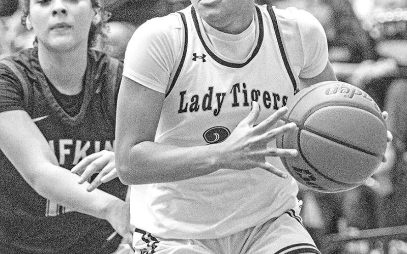 Kaylin Brannon attacks the paint in the :Lady Tiger win against Lufkin.