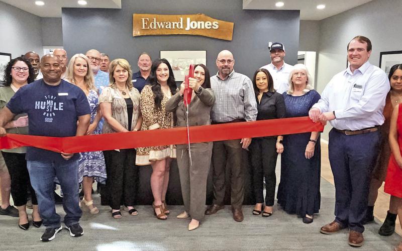 The red ribbon was cut to celebrate the finished renovations for Edward Jones