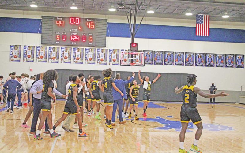 The Mount Pleasant Tigers celebrate immediately following their 46-44 regional quarterfinal win over Highland Park.