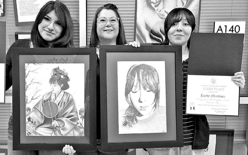(L to R) Dayanara Pulquero with her piece, Calm Envy, MPHS art instructor Laura Kirkland, Jaydy Martinez with her piece, Color Jaydy in Stipple