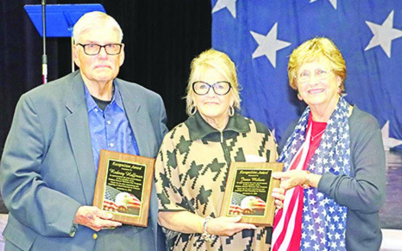 Rodney Huffman (left) and Jana Milam (center) are honored by MPISD Board President Yvonne Hampton (right) for starting the Wallace Veteran’s Day Program 25 years ago