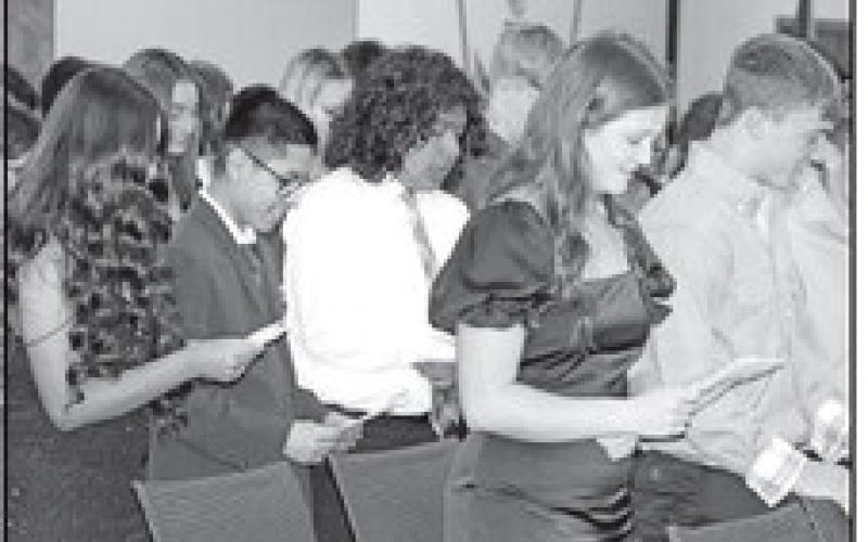 New MPHS NHS inductees take the National Honor Society pledge COURTESY PHOTOS