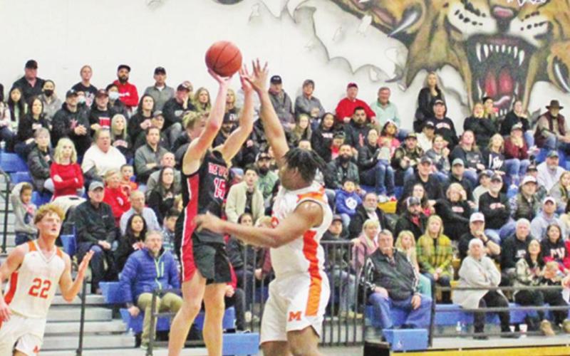 Chapel Hill’s Braden Buchanan puts up a shot during a recent game. The Red Devils took on Tatum Friday evening in an area round matchup. TRIBUNE PHOTO / QUINTEN BOYD