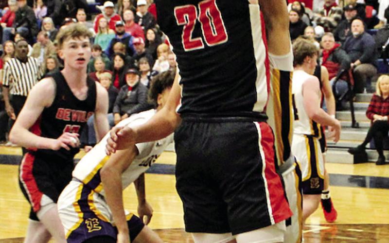 Chapel Hill’s Max Daniel (20) goes up for a short jumper against Edgewood last week. COURTESY PHOTOS / JAMES WATSON