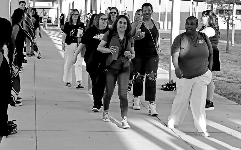 The MPHS Colorguard lined the sidewalks as staff members entered from the parking lots.