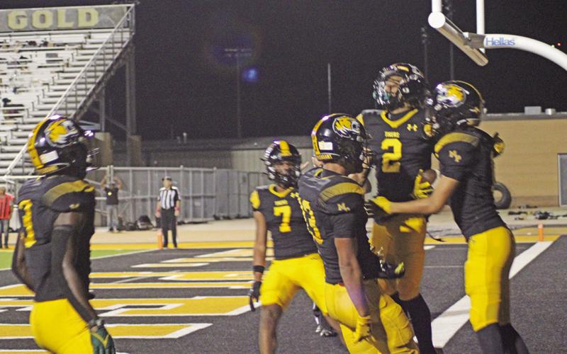 From left, Braylon Jones, Kevi Heath, Kyler Smith, Dylan Bennett and Payton Chism celebrate Chism’s second quarter touchdown that would give Mount Pleasant a lead they would not relinquish in their Homecoming win over Nacogdoches. The Tigers won, 45-13. TRIBUNE PHOTO / QUINTEN BOYD