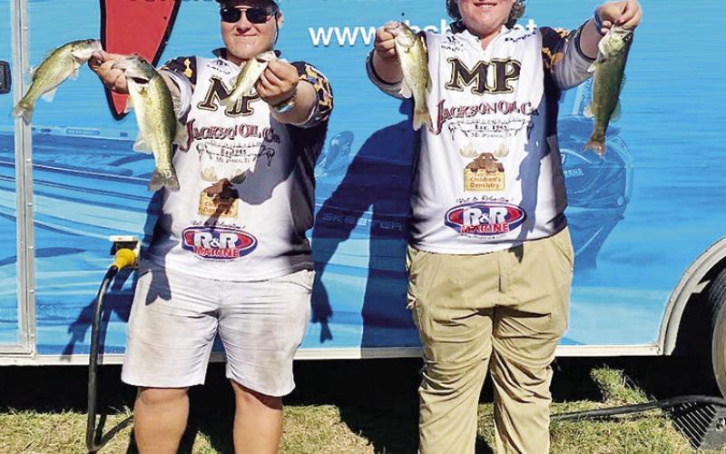 Clayton Miller (left) and Rolston Morton (right) show off their catches for the day.