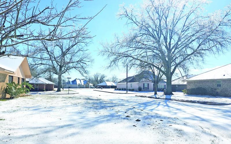 Neighborhood roads covered by a blanket of snow