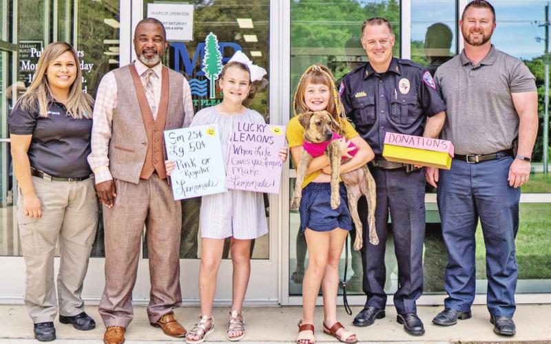 Pictured from left are Estefania Flores, Animal Shelter Customer Service; Mayor Tracy Craig, Sr., Emy Chappell; Tenley Marshall; Police Chief Mark Buhman; and Lt. Travis Nichols. COURTESY PHOTO