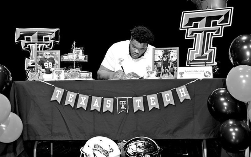 Ayden Johnson signs to play football for the Raiders at Texas Tech University
