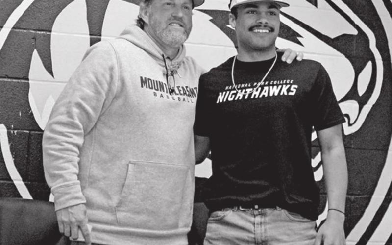 Mount Pleasant’s Evan Grissom signed his National Letter of Intent to play baseball at National Park College in Hot Springs, Ark. Grissom is pictured with Tiger baseball Head Coach Tommy Stewart. TRIBUNE PHOTO / QUINTEN BOYD