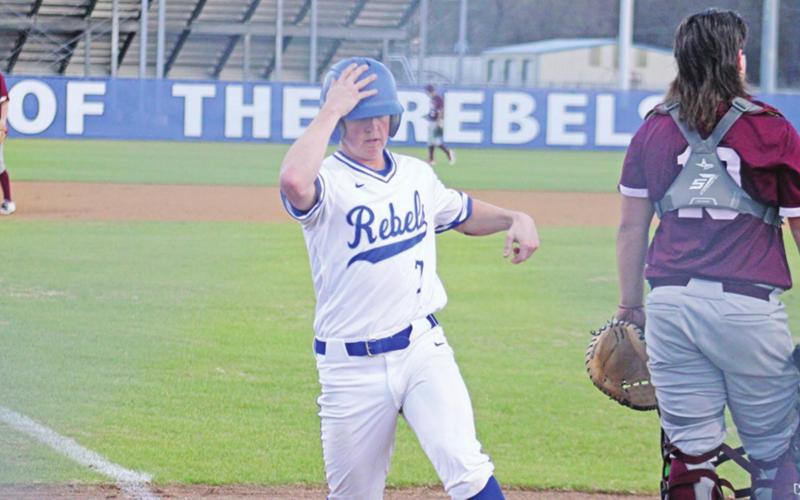 Rivercrest’s Connor Young crosses home plate during a recent game. The Rebels fell to 1-2 in district play after a 5-3 loss to James Bowie Wednesday,