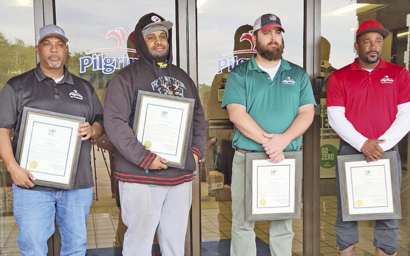 Mayor extends awards to four local Pilgrim’s workers turned heroes