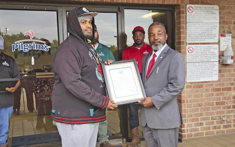Mayor extends awards to four local Pilgrim’s workers turned heroes