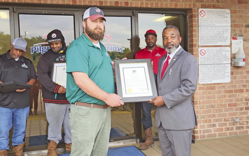 Mayor extends awards to four local Pilgrim’s workers turned heroes