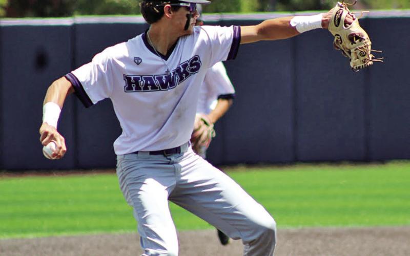 David Harrison steadies himself to throw the Paris Homeschool runner at first after fielding a ground ball. COURTESY PHOTOS