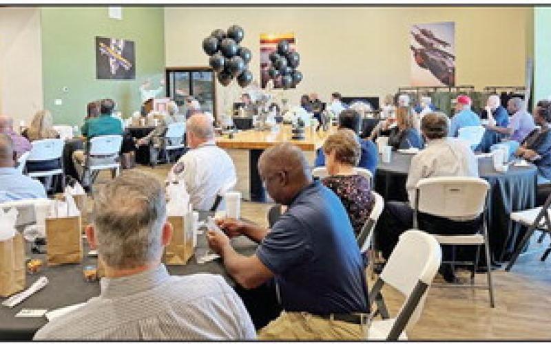 City Manager Ed Thatcher hosted the East Texas City Management Association’s monthly luncheon at the Mid-America Flight Museum with Scott Glover, owner/curator of the museum, and Pilgrims sponsoring the gathering. COURTESY PHOTO