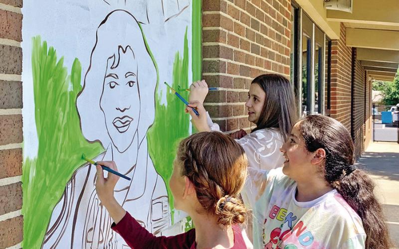 Willa Logue, Esmeralda Guerrero, and Aubrey White work on painting Ellen Ochoa COURTESY PHOTOS