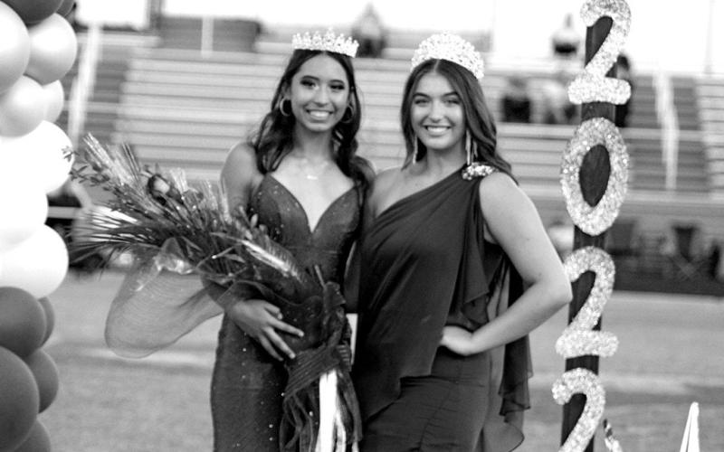 Selena Kelley (left) was named 2022 Rivercrest High School Homecoming Queen during pregame ceremonies Friday night. She is pictured with 2021 Homecoming Queen Kaytie Jane Ballard. TRIBUNE PHOTO / QUINTEN BOYD