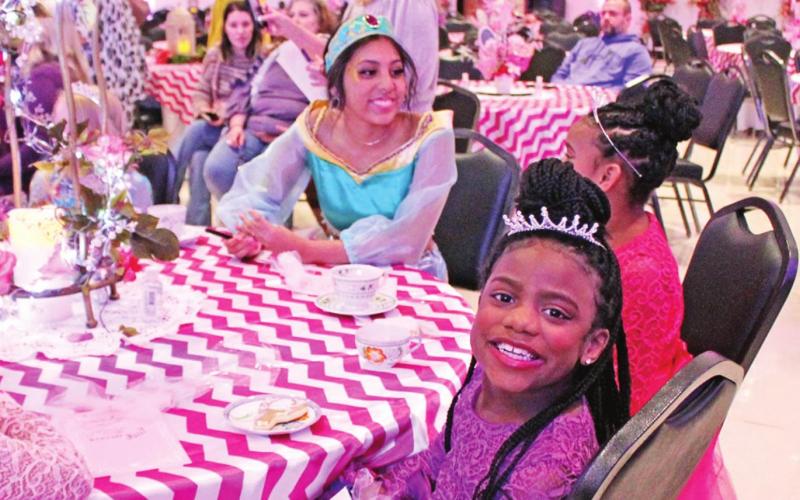 Jasmine talks to a couple of little princesses.