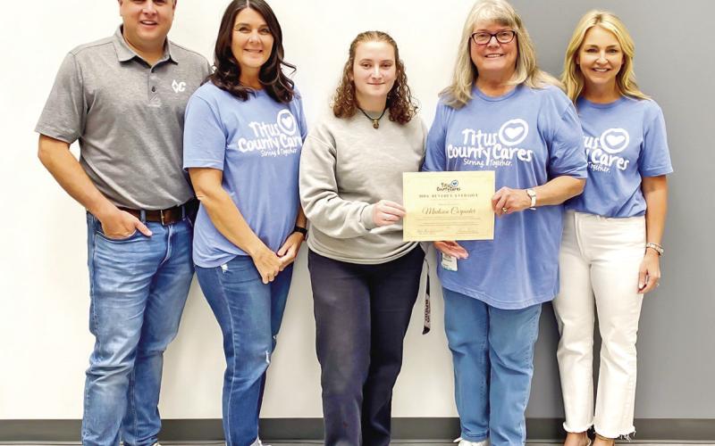 Titus County Cares awards Mrs. Beverly Eversole scholarships