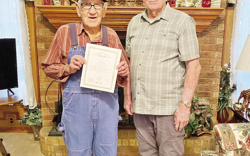 Bill Guy, the District Deputy of the Masonic Lodge of Mount Pleasant, presents Ellis Moore, 98, with his 65-year anniversary pin and a certificate. Moore, a 32nd degree Mason, is also a World War II Veteran and lives here in Mount Pleasant. COURTESY PHOTO