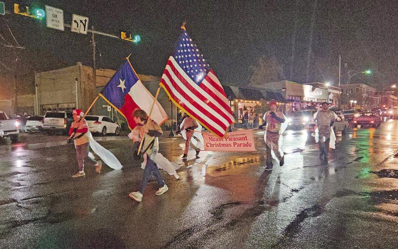 A Merry Musical Christmas parade sings on through rainy weather