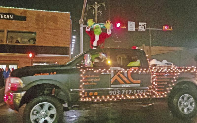 A Merry Musical Christmas parade sings on through rainy weather