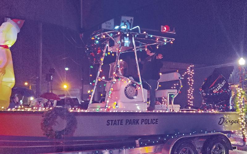 A Merry Musical Christmas parade sings on through rainy weather