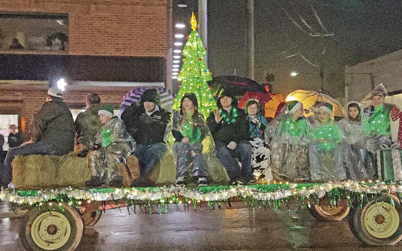 A Merry Musical Christmas parade sings on through rainy weather