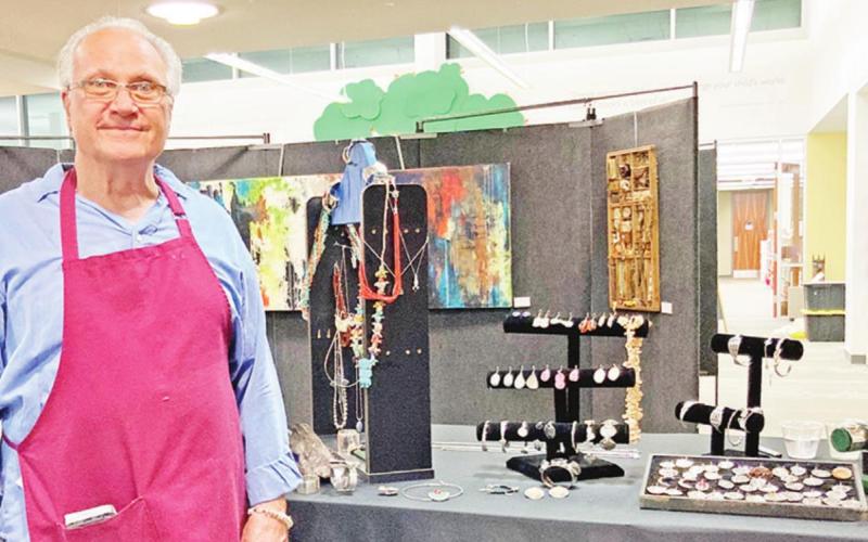 Joseph Parks shows off his silver work at the Evening of Art. TRIBUNE PHOTO / DI ANA FITZGERALD