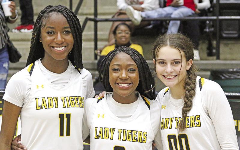 From left, Aziyah Farrier, Paris Beard and Ella Cross were all recognized for their play last weekend at the Royse City Tournament. Beard was named Tournament MVP and both Farrier and Cross were named to the All-Tournament Team. The Lady Tigers claimed the title with a 58-43 win over Dallas Christian. TRIBUNE PHOTO / QUINTEN BOYD