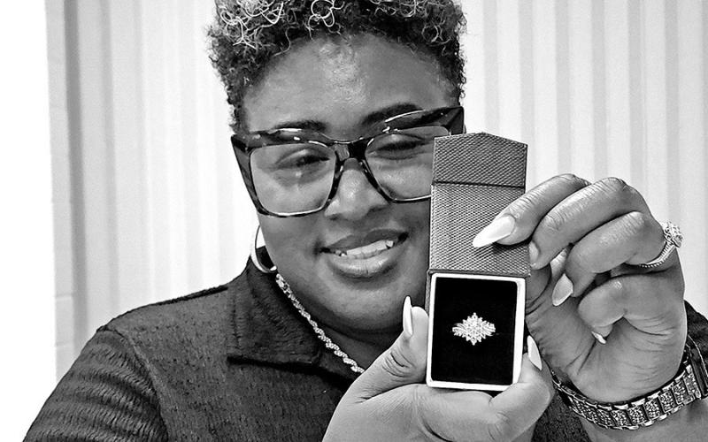 Raffle winner shows off the diamond ring she won