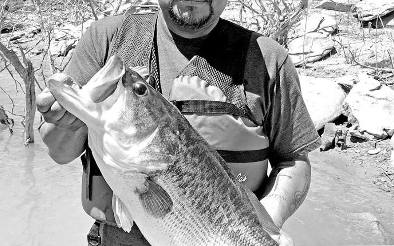Ross Gomez with the the 13.22 pound Toyota ShareLunker he caught while fishing from the public dock at Sam Wahl Recreation Area on Lake Alan Henry in February 2023. The fish produced nearly 34,000 fingerlings during its brief stay at the TFFC and was released back into Alan Henry the following April. (TPWD Photo)