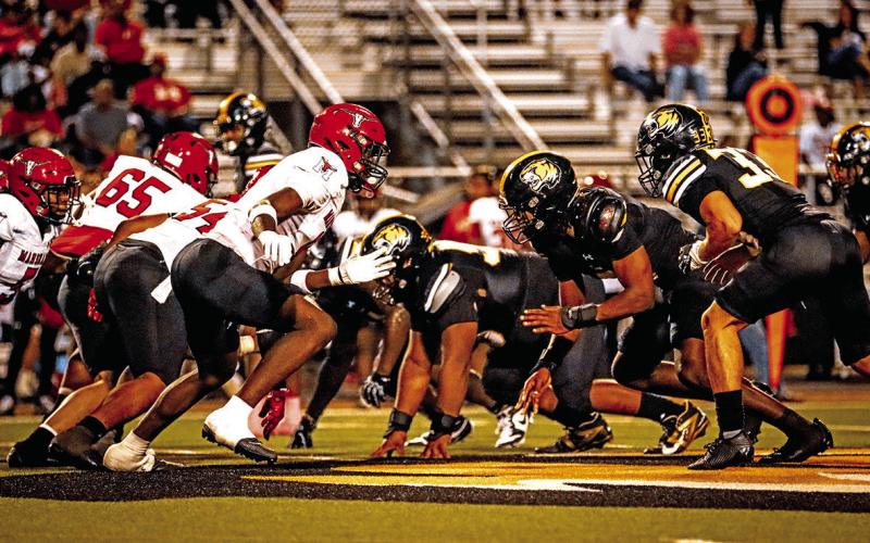 The Tiger defense takes on the Mavs in the trenches at Sam Parker Field.