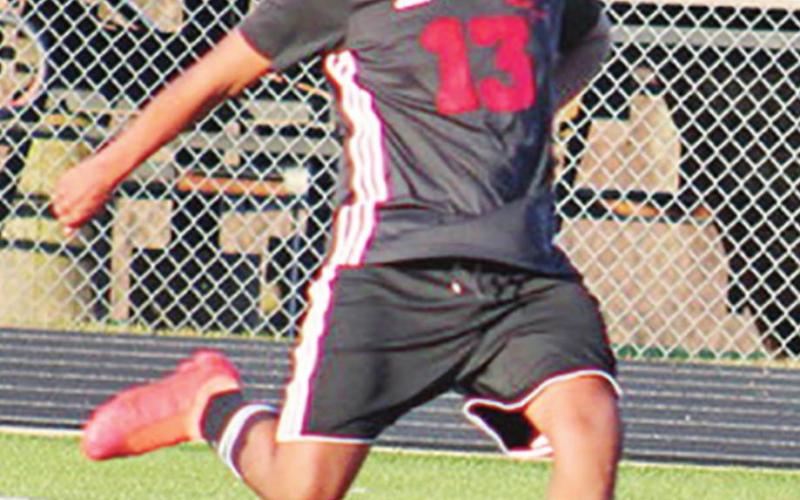 Chapel Hill’s Lucas Banda makes a pass during the Red Devils’ game against Texas High.The Red Devils went 1-2 for the tournament. COURTESY PHOTO