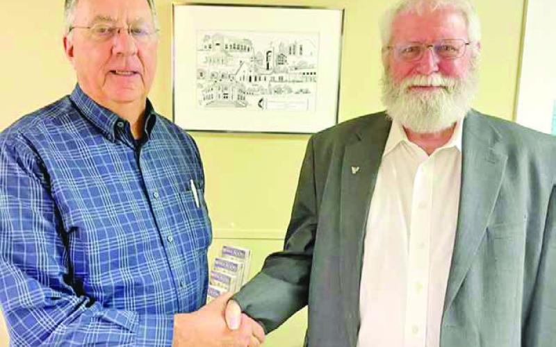 Pastor Mark McClanahan of Tennison Memorial United Methodist Church announced the new Chairman of the Board of Trustees. New Chairman Jerry Hearron (left) receives best wishes from outgoing chairman Read Pearson (right.) COURTESY PHOTO