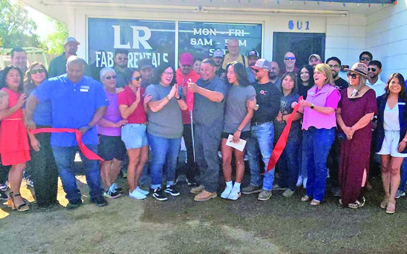 LR Fab &amp; Rentals celebrate the snip of their red ribbon