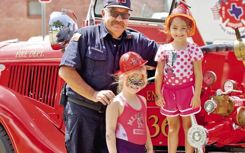 The Mt. Pleasant fire dept. posed with kids at the Mt. Pleasant Farmers Market on July 12 Photo courtesy of City of Mt. Pleasant